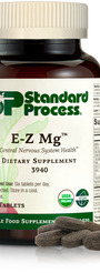 Image of E-Z Mg bottle next to tablets of magnesium supplements.