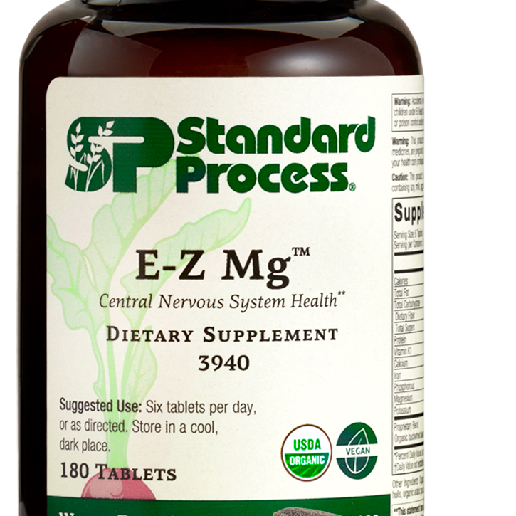 Image of E-Z Mg bottle next to tablets of magnesium supplements.