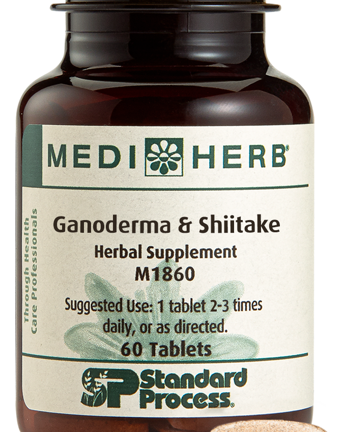 A bottle of Ganoderma & Shiitake herbal supplement next to a tablet.